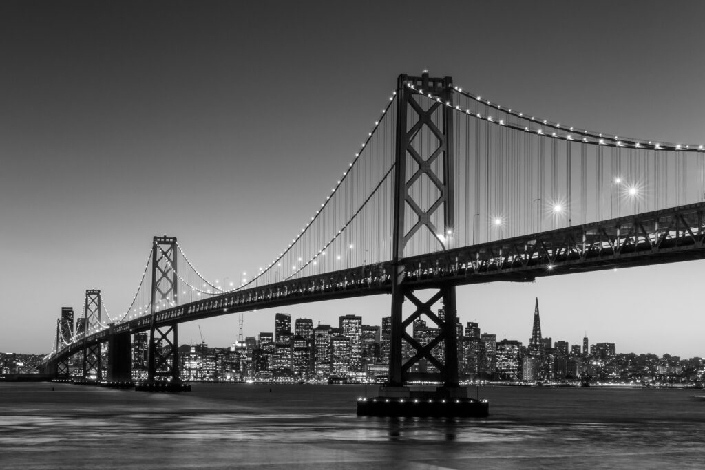 San Francisco skyline and Bay Bridge at sunset, California